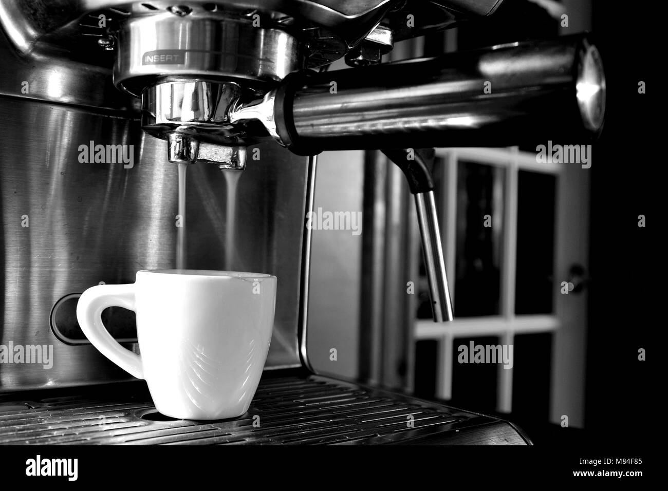 Making the perfect morning espresso lungo Stock Photo Alamy