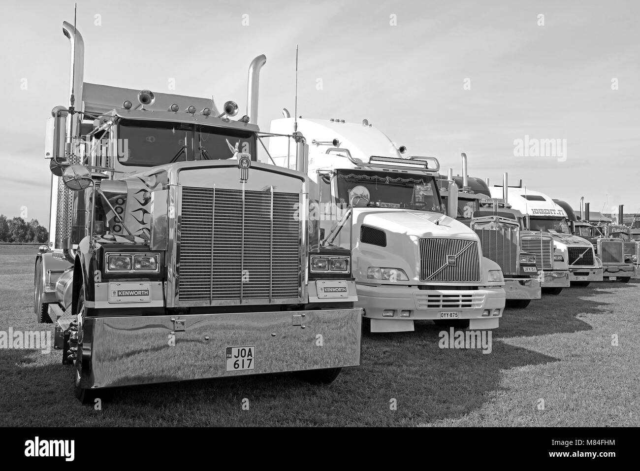 ALAHARMA, FINLAND - AUGUST 11, 2017: Classic conventional Kenworth, Volvo and Peterbilt trucks on display on Power Truck Show 2017, image in black and Stock Photo
