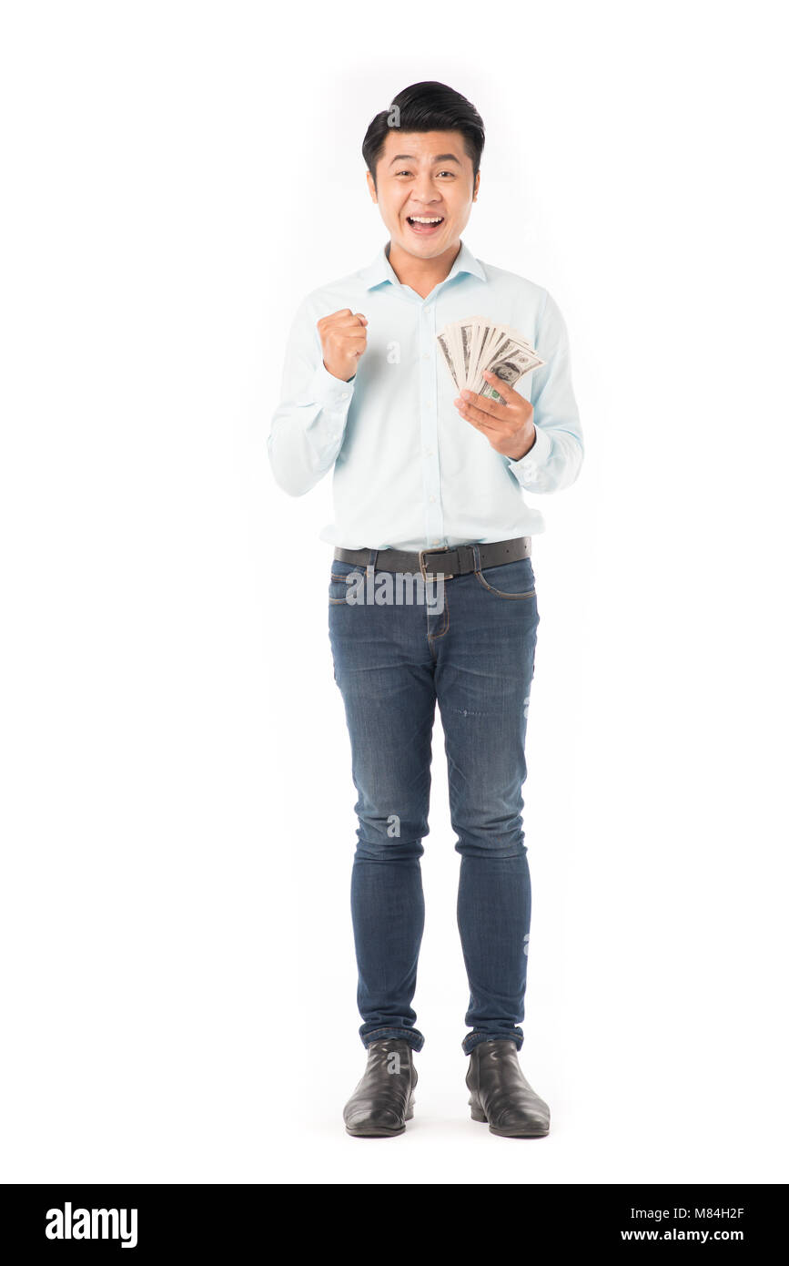 Asian man holding money Stock Photo