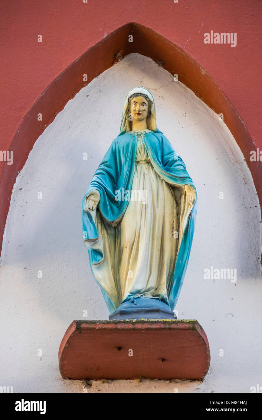 Madonna figure, holy St. Mary, at house facade in Oestrich-Winkel, Hesse, Germany, Europe Stock Photo
