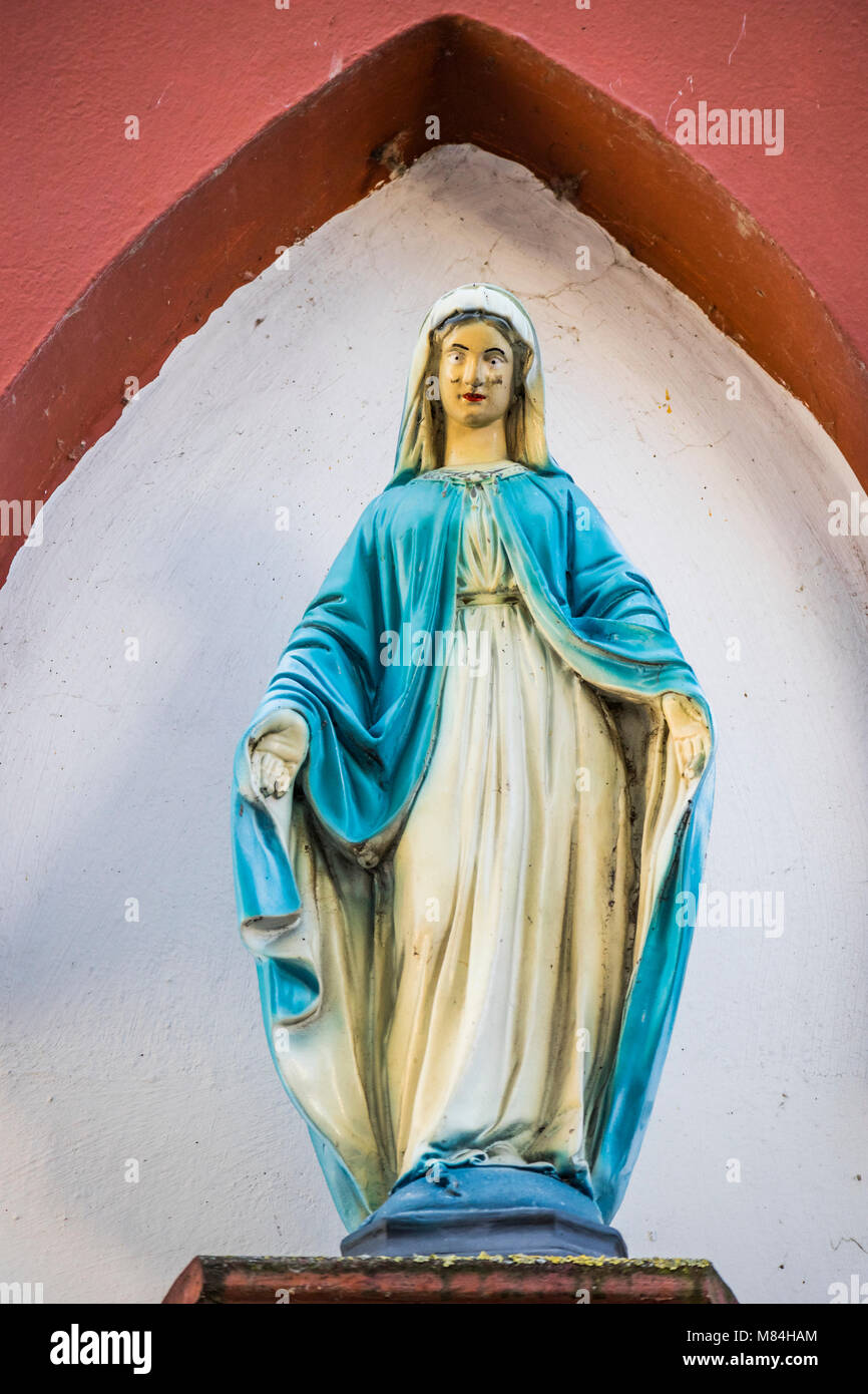 Madonna figure, holy St. Mary, at house facade in Oestrich-Winkel, Hesse, Germany, Europe Stock Photo