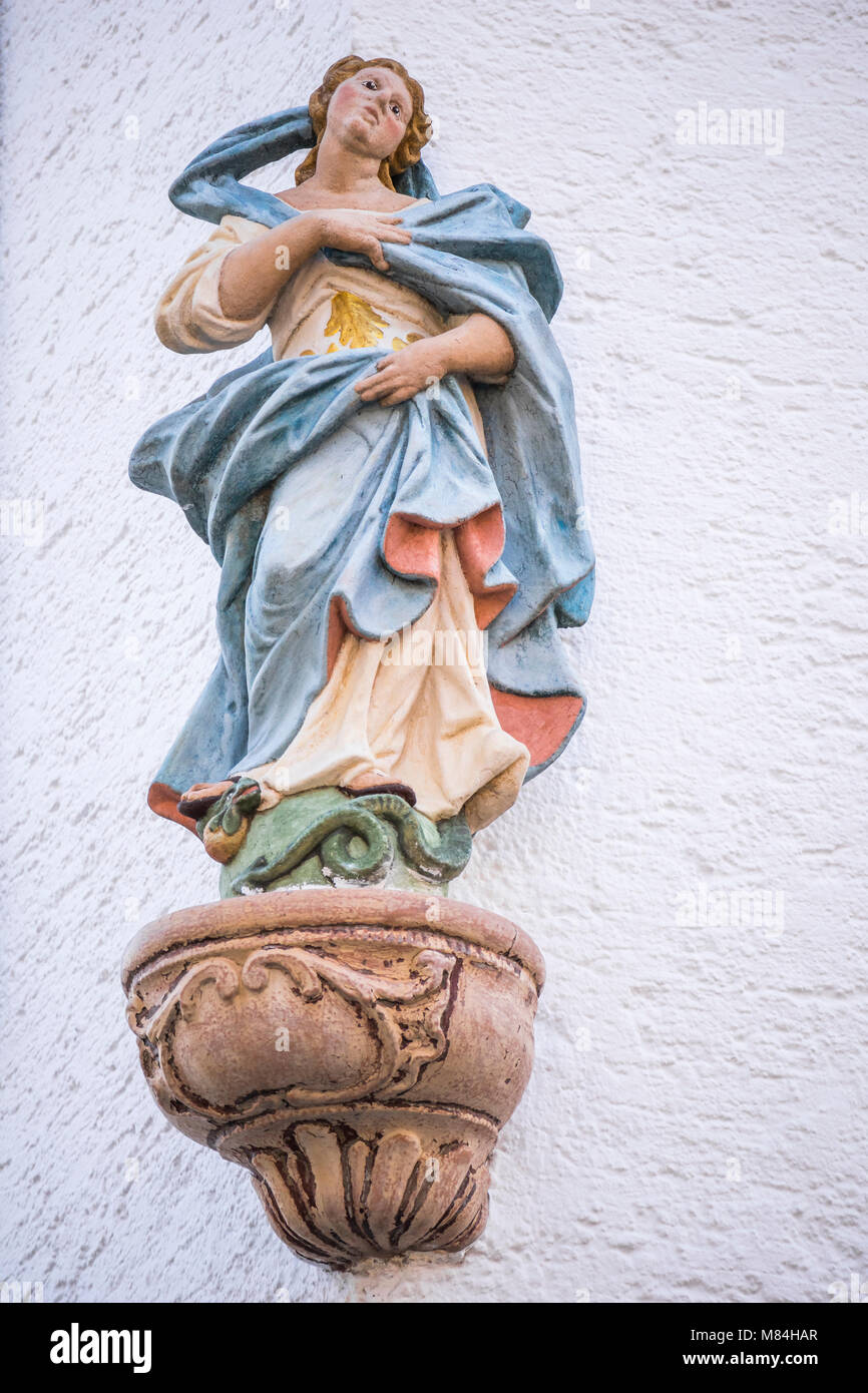 Madonna figure, holy St. Mary, at house facade in Oestrich-Winkel, Hesse, Germany, Europe Stock Photo