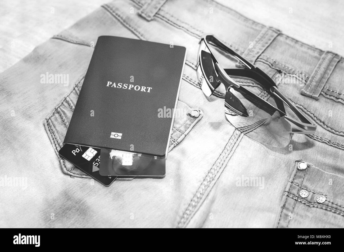 Passport with bank cards, glasses and seashells. The concept of travel Stock Photo