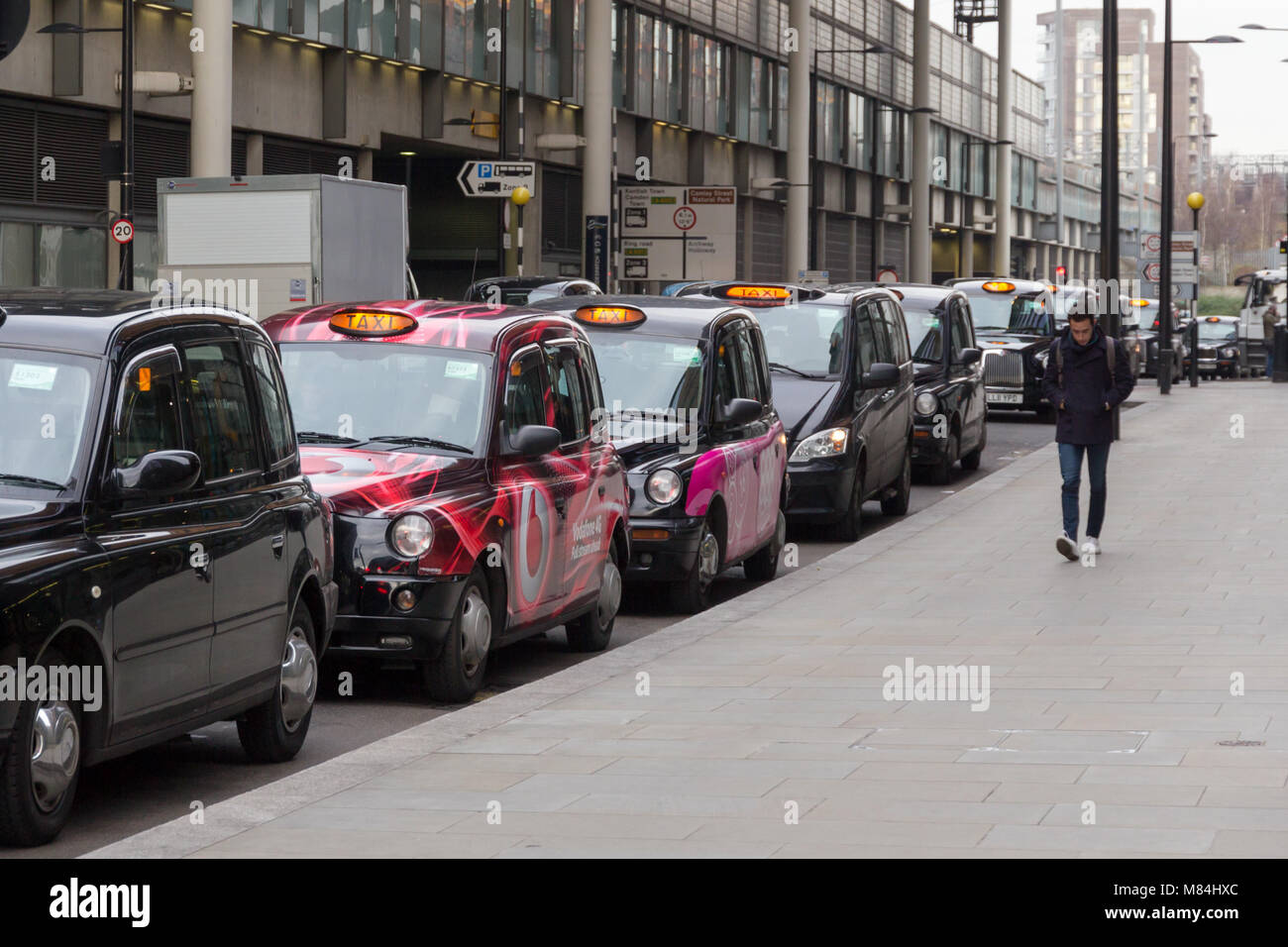 Parked London taxis awaiting a fare near Kings Cross Station Stock Photo