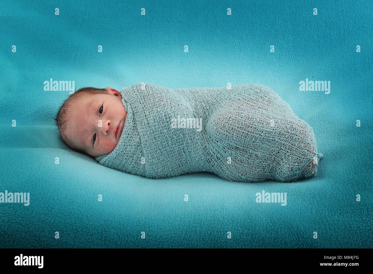 Cutie Newborn Baby Girl On Sensory Swing In Nursery