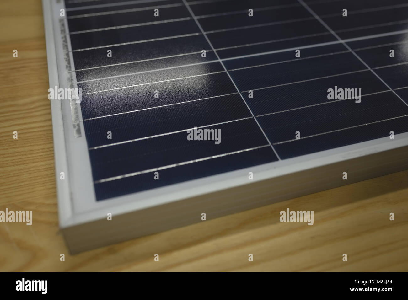 Solar panel on wooden table in office Stock Photo