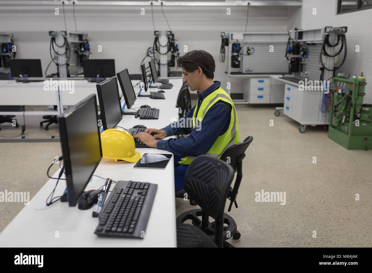 Male worker working on computer Stock Photo
