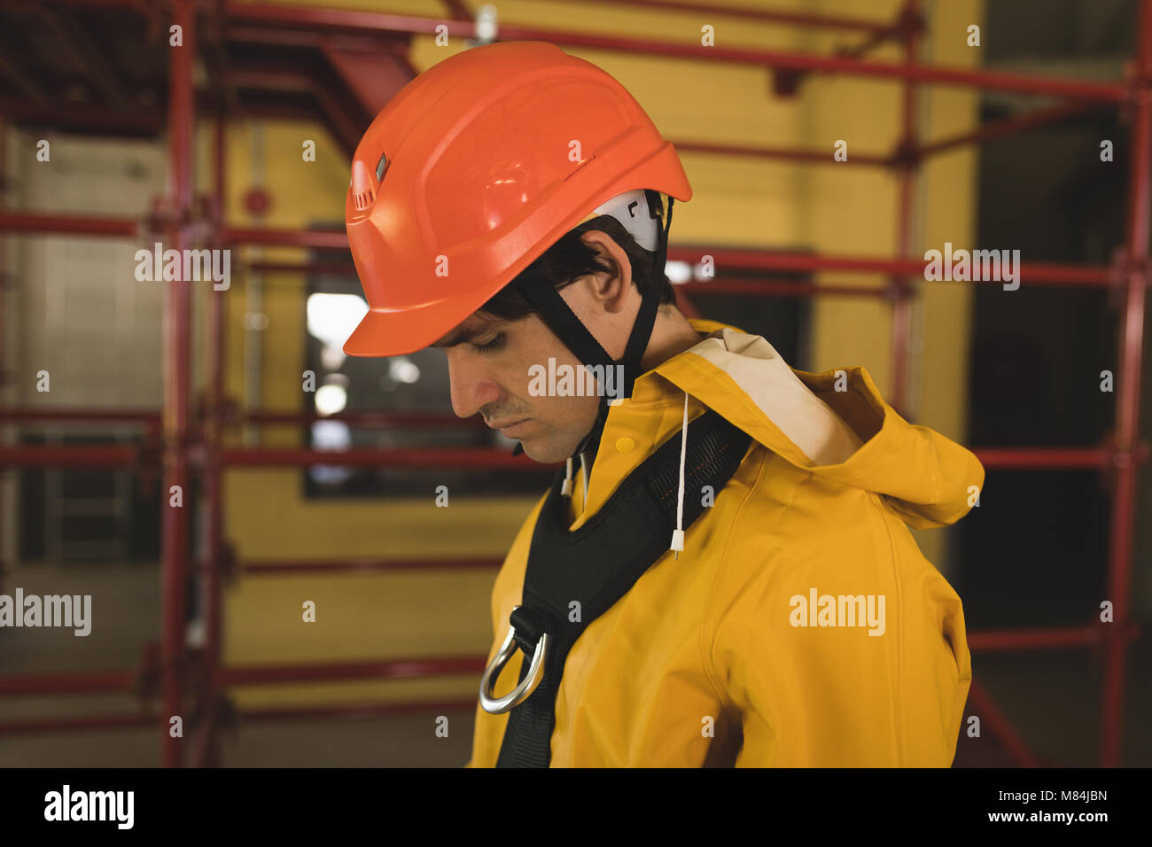 Male worker wearing hard hat at solar station Stock Photo