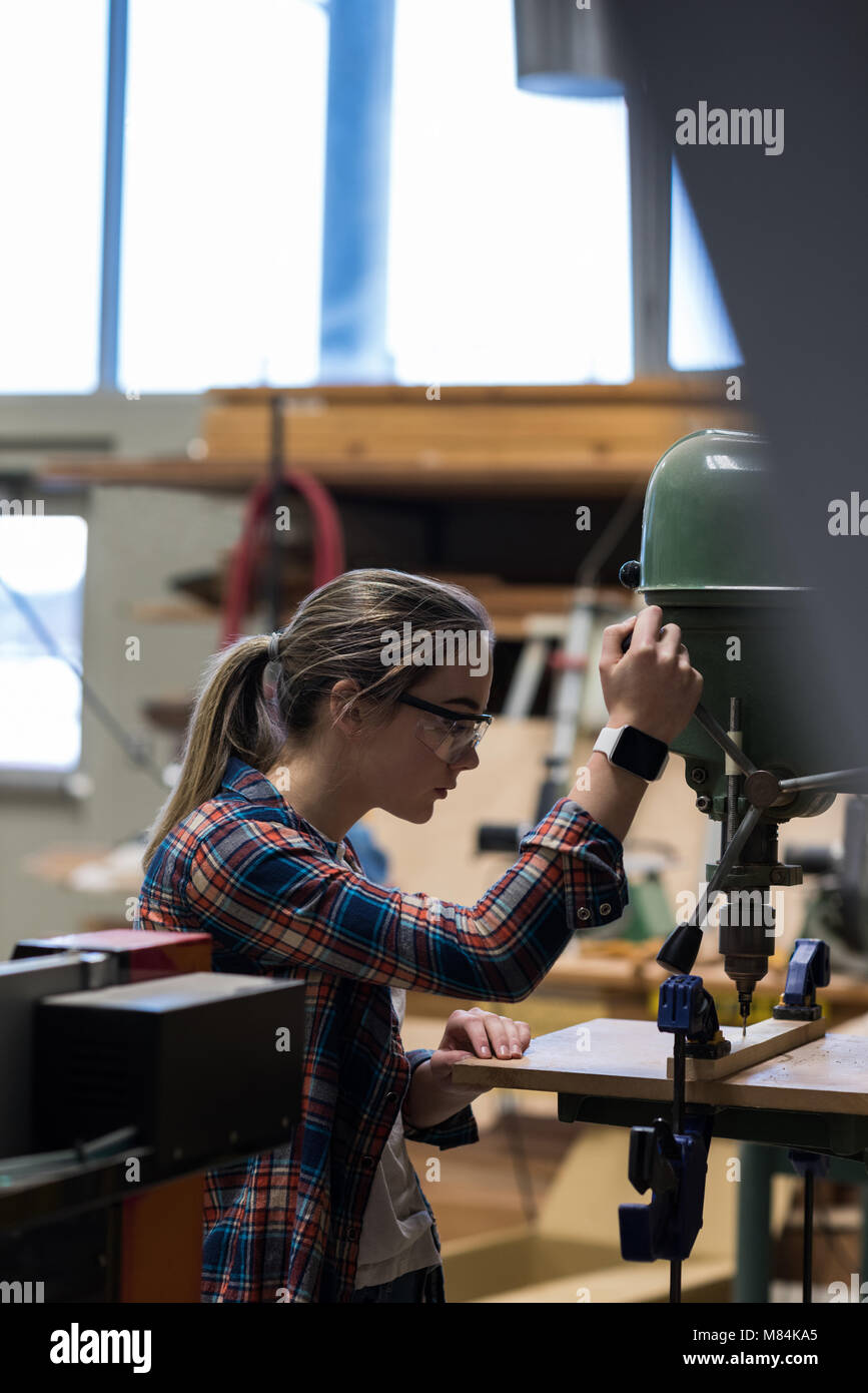 Female carpenter using clamp hi-res stock photography and images - Alamy