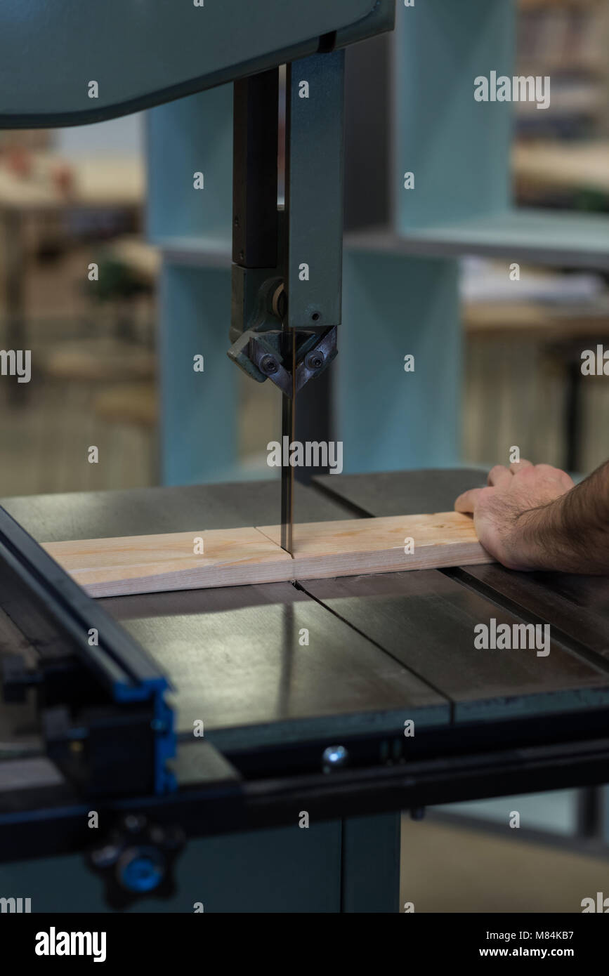 Male carpenter using vertical cutter machine Stock Photo Alamy