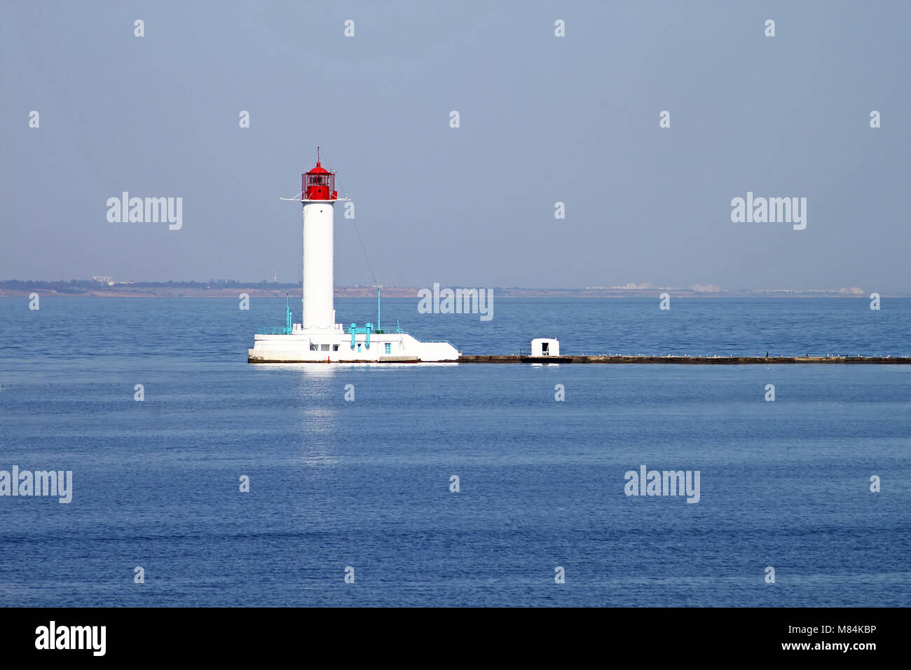 White lighthouse against the blue sky in Odessa, Ukraine Stock Photo
