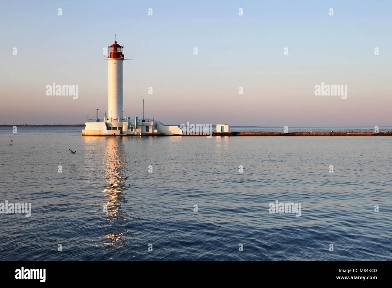 White lighthouse in the evening, Odessa, Ukraine Stock Photo