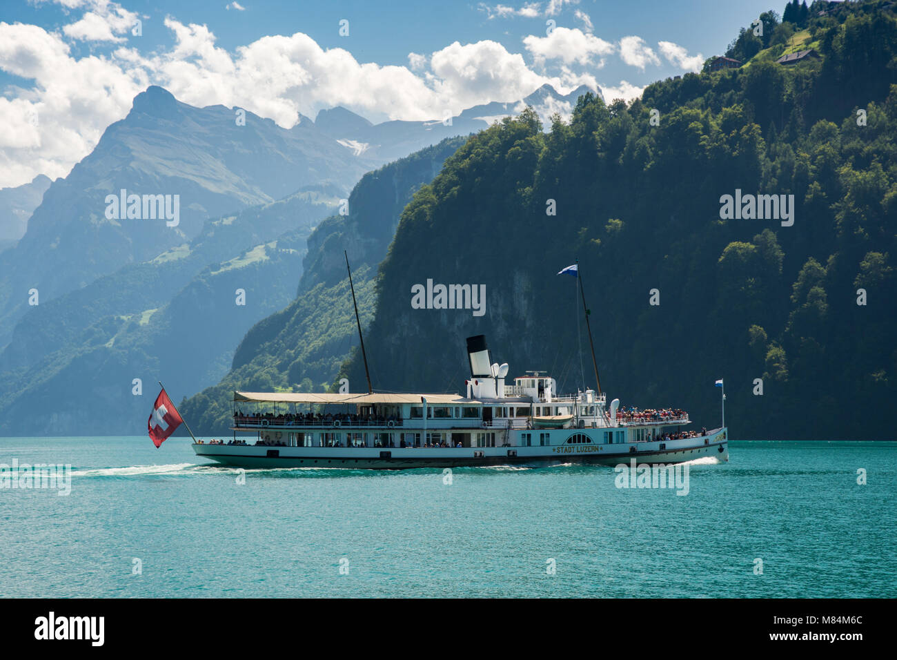 BRUNNEN, SWITZERLAND - AUGUST 2017 - Ship full of tourists on Lake Lucerne near Brunnen in Switzerland Stock Photo