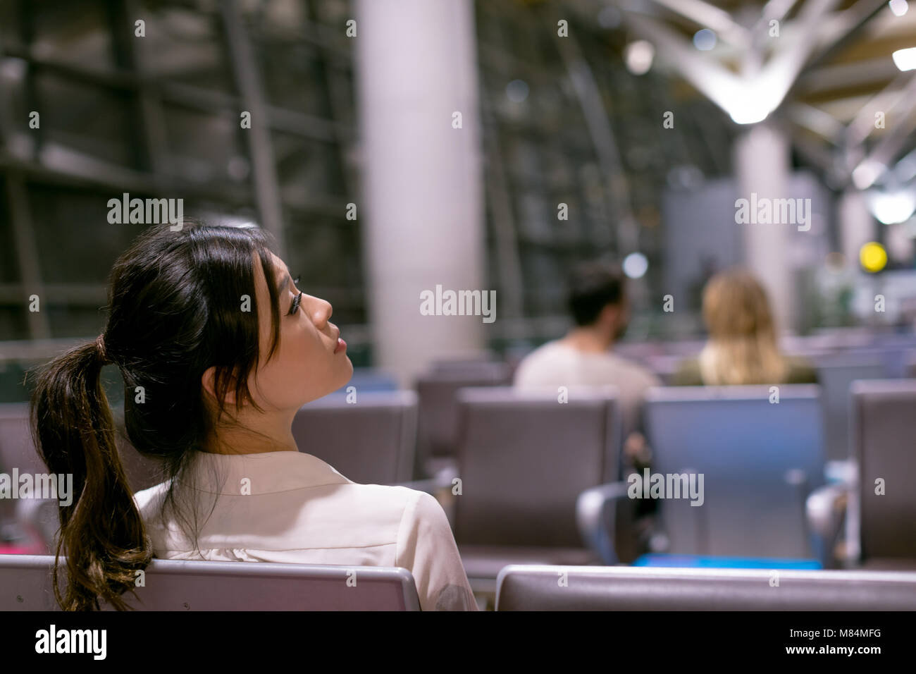 Young beautiful woman in airport hi-res stock photography and images ...