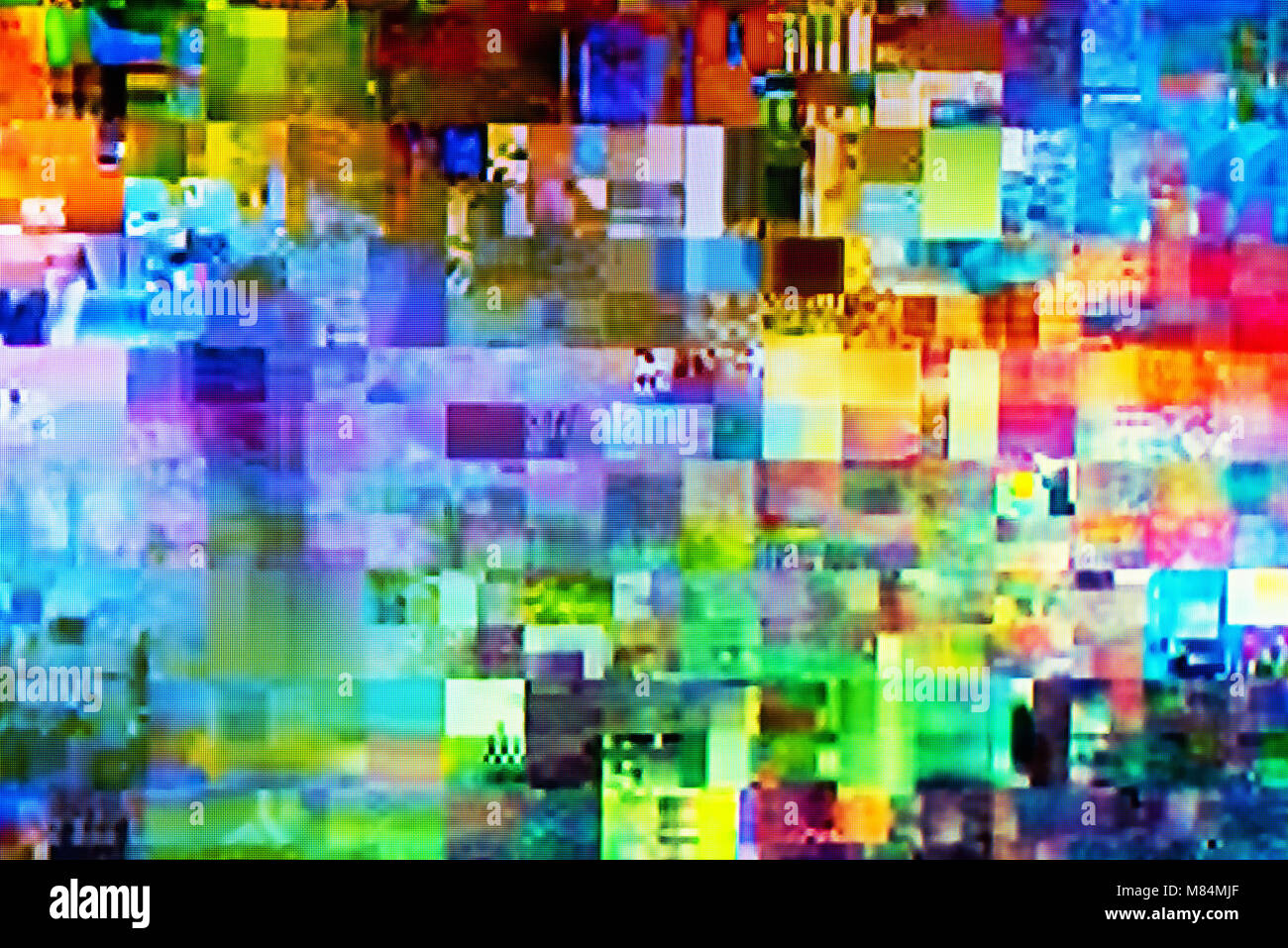 Digital TV glitch on television screen with misplaced squares, static effects and freezing problems during broadcast failure Stock Photo