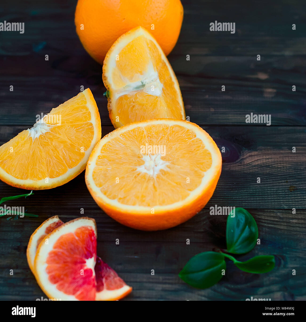 glass of fresh orange juice, whole orange and orange slices group on a