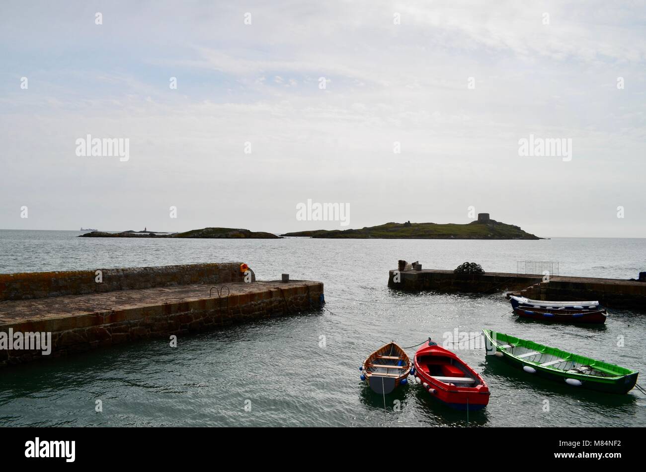 Red Boat, Green Boat and White Boat waiting at Dalkey Harbour, Dublin Stock Photo
