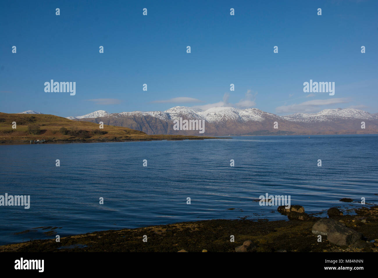 View across Loch Etive in Western Scotland in winter with snow on the hills. Stock Photo