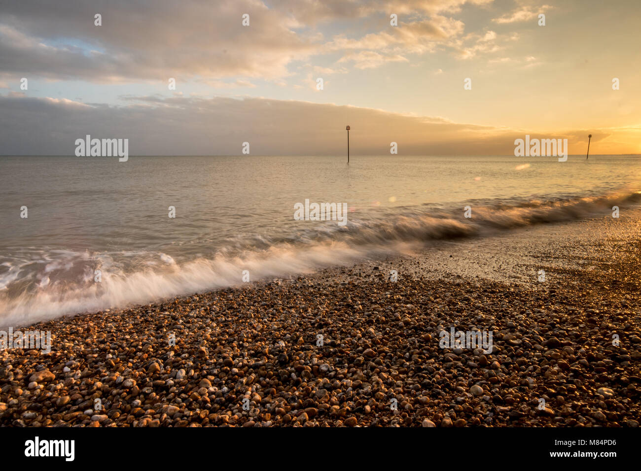 High tide at dusk on the pebble beach, Bognor Regis promenade, near