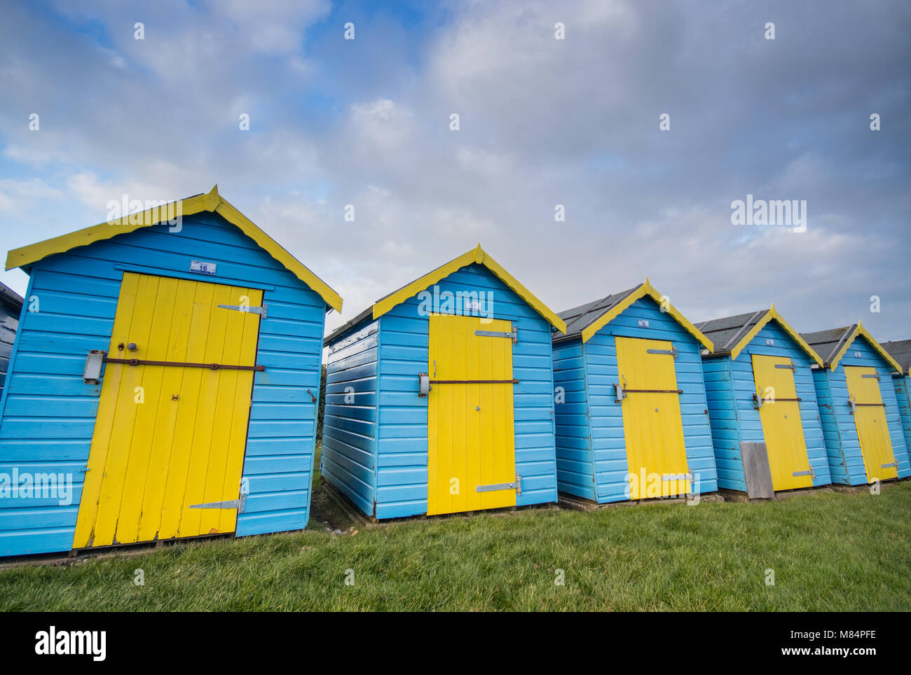 Beach huts at Felpham Greensward on the promenade near Bognor Regis