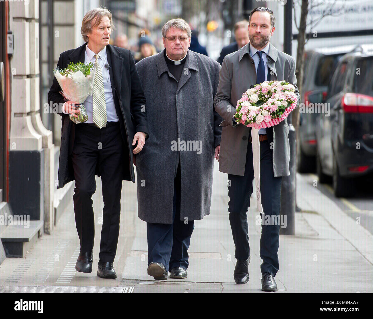 (left to right) Father of Martine Vik Magnussen Odd Petter Magnussen, Norwegian Rector and Senior Chaplain Torbjorn Holt and Head of Martine Foundation Patrick Lundevall-Unger, arrive at Great Portland Street in London to lay flowers where the body of Mr Magnussen's daughter was found. Stock Photo
