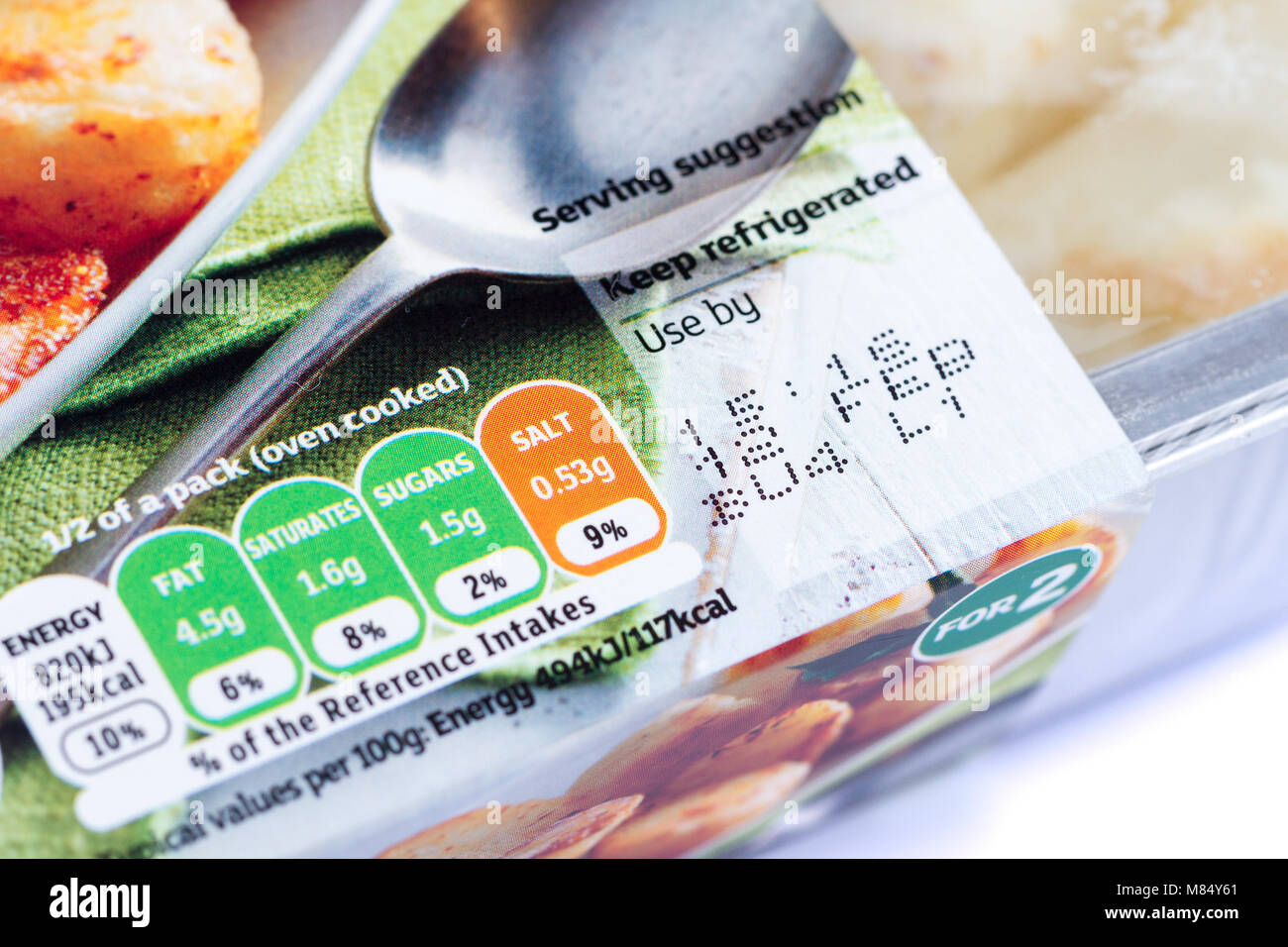 Use by date on a pack of roast potatoes, United Kingdom Stock Photo
