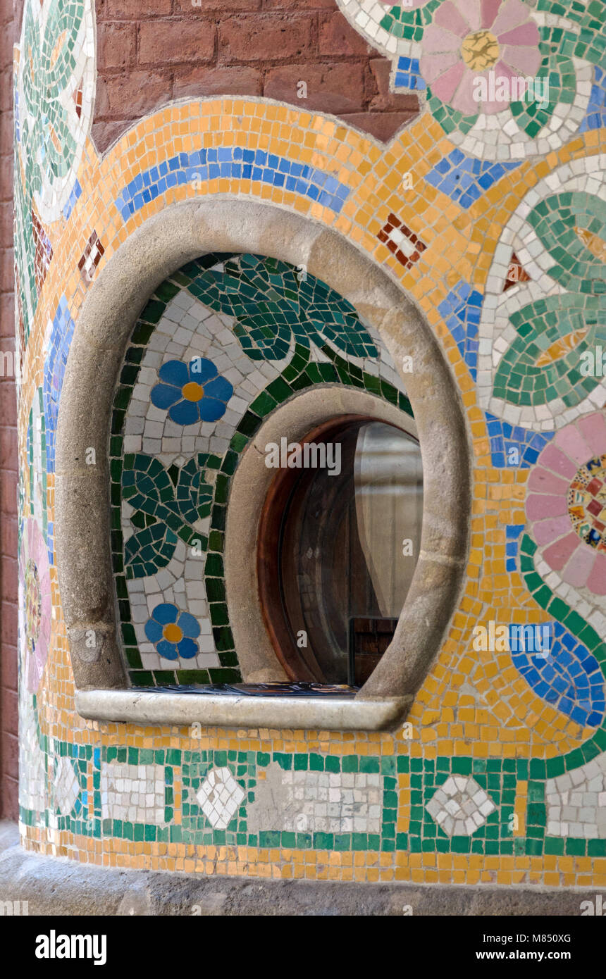 Mosaic flowers surround a ticket window in the façade of the Palau de la Música Catalana, Barcelona, Spain Stock Photo
