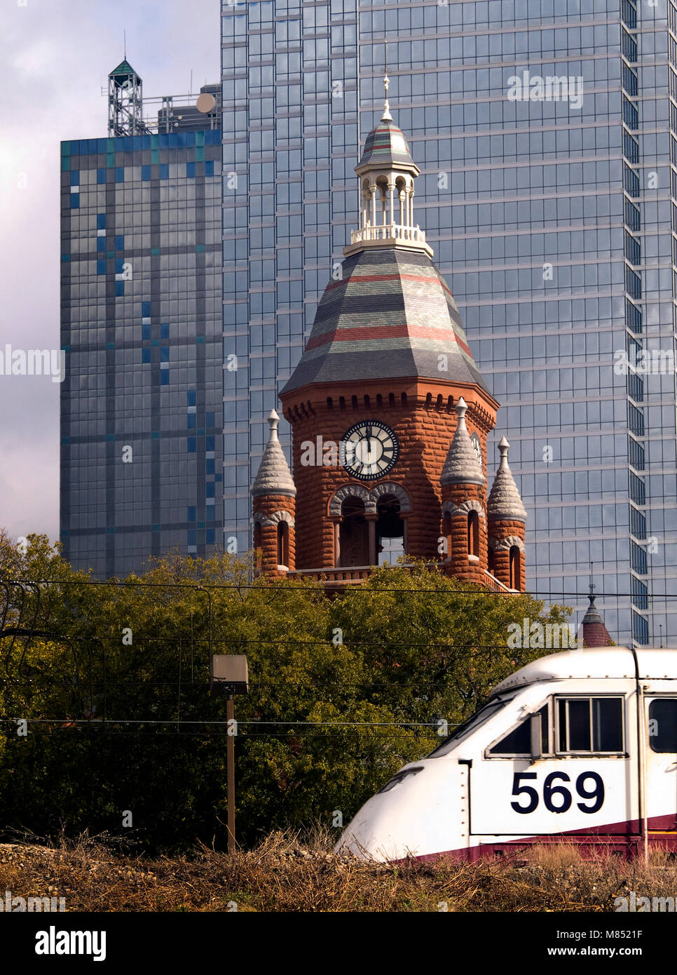 New and old, in downtown Dallas, Texas, you can compare architecture from the nineteenth century with modern skyscrapers. The old Dallas county courthouse has been turned into a museum and visitors center. Built in 1892 it is today called the Old Red Courthouse. and is in walking distance to the convention center. Stock Photo