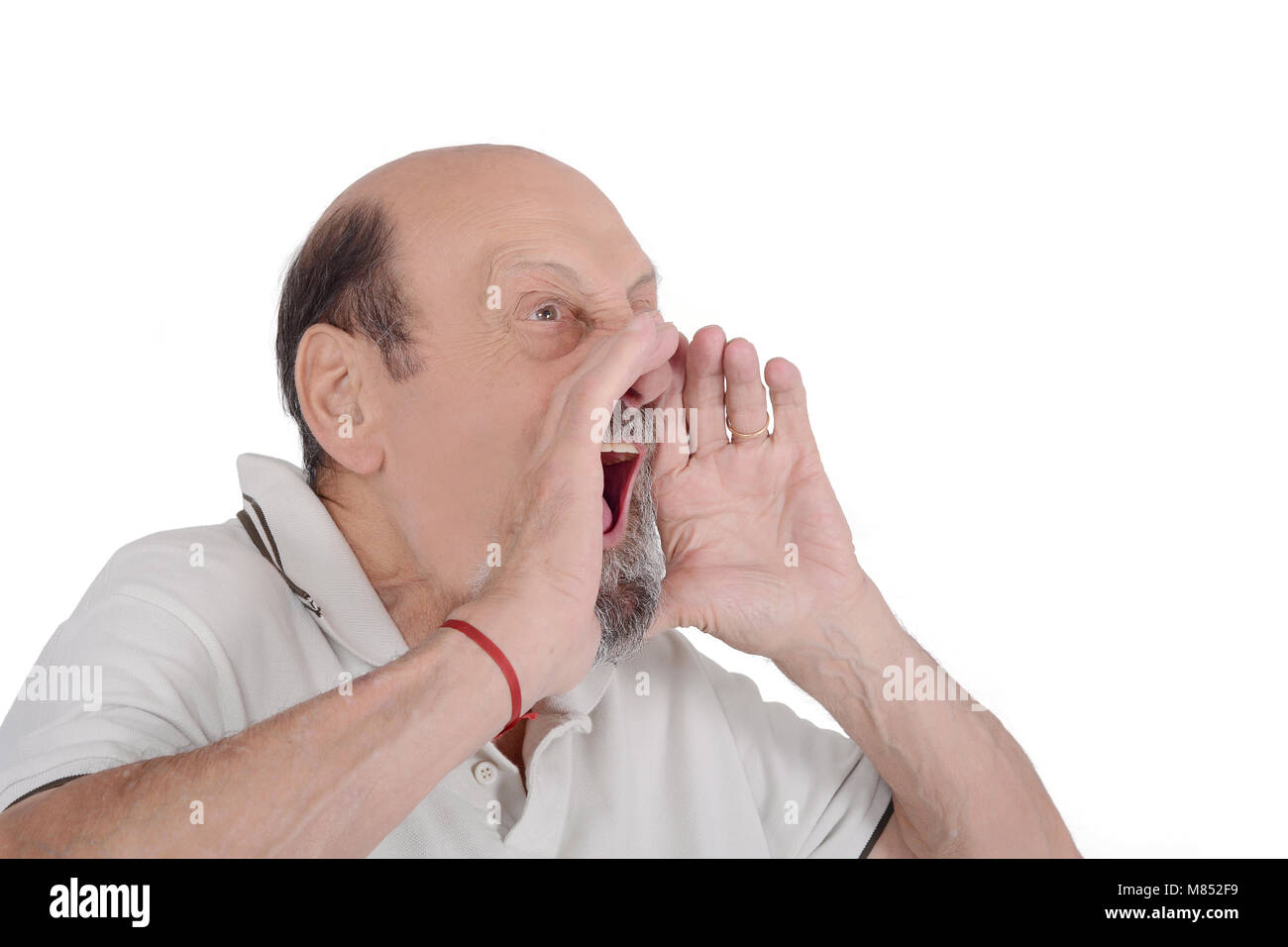 Portrait of elderly man screaming with her hands on face. Isolated white background Stock Photo