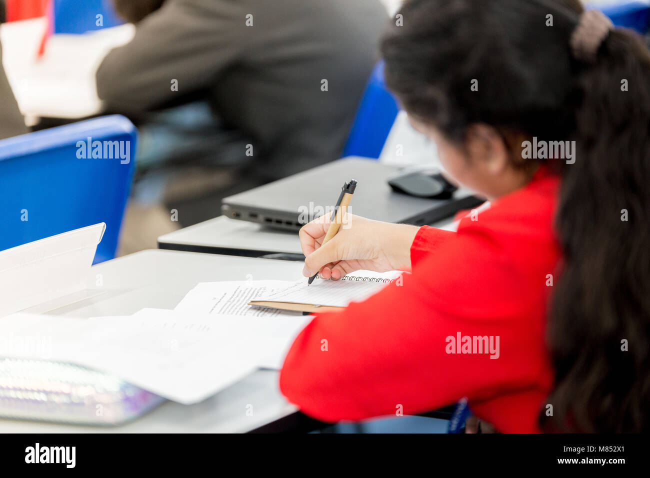 Student studying hard in class Stock Photo