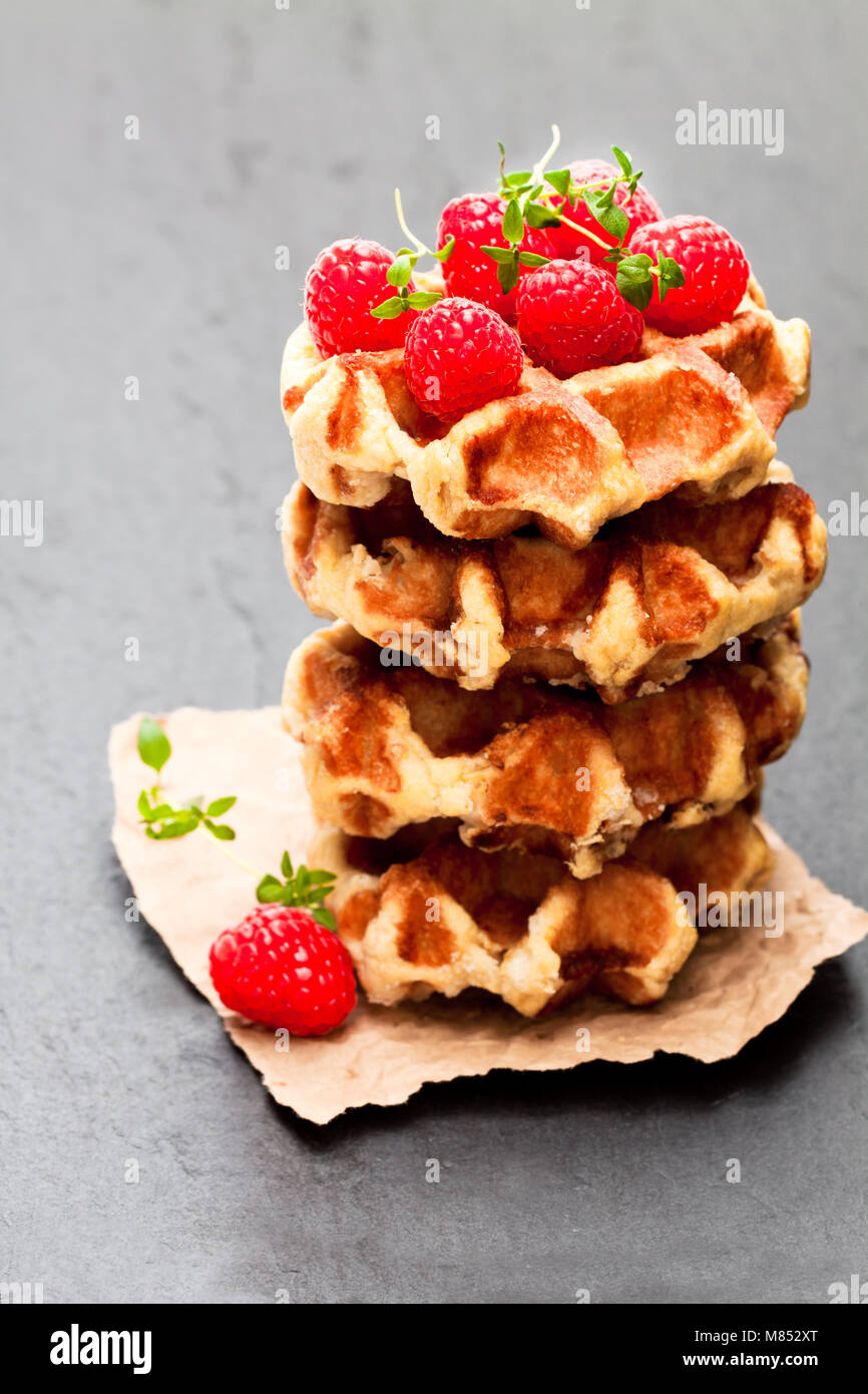 Continental classics belgian butter waffles with raspberries on black