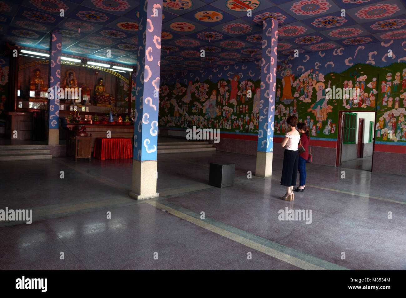 Kolkata, India. 14th Mar, 2018. Chinese women pray to Buddha at Hsuan Tsang monastery during the 50th year celebration. Chinese people celebrates 50th anniversary of Hsuan Tsang monastery the only Chinese Buddhist temple in Kolkata. The Hsuan Tsang monastery built in 1968 and named after the famous Chinese Buddhist monk and traveler Hsuan Tsang who came to India about 1400 years ago. Credit: Saikat Paul/Pacific Press/Alamy Live News Stock Photo