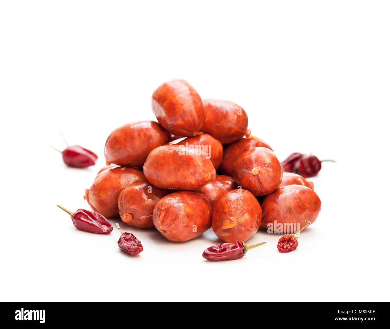 Strings of mini chorizo sausages with hot chili isolated on white Stock Photo Alamy