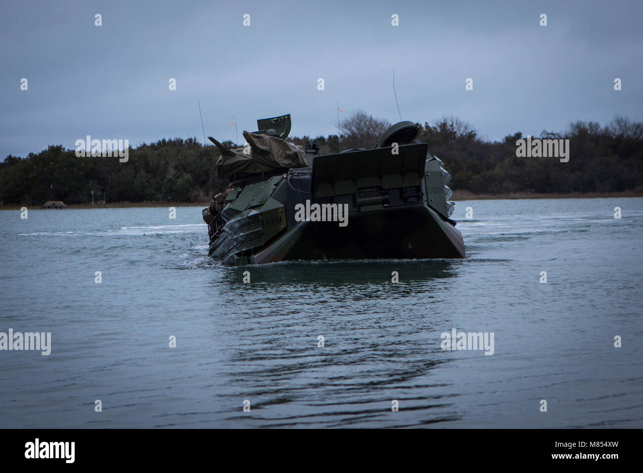 U.S. Marines with 2nd Assault Amphibian Battalion (2d AABN), 2nd Marine Division (2d MARDIV), conduct an amphibious movement aboard an AAV-7A1 Assault Amphibious Vehicle during the unit's Marine Corps Combat Readiness Evaluation (MCCRE) on Camp Lejeune, N.C., March 12, 2018. The MCCRE is a pre-deployment training evaluation designed to test the skills of Marines and Sailors with possible combat scenarios. (U.S. Marine Corps photo by Lance Cpl. Christian J. Robertson) Stock Photo