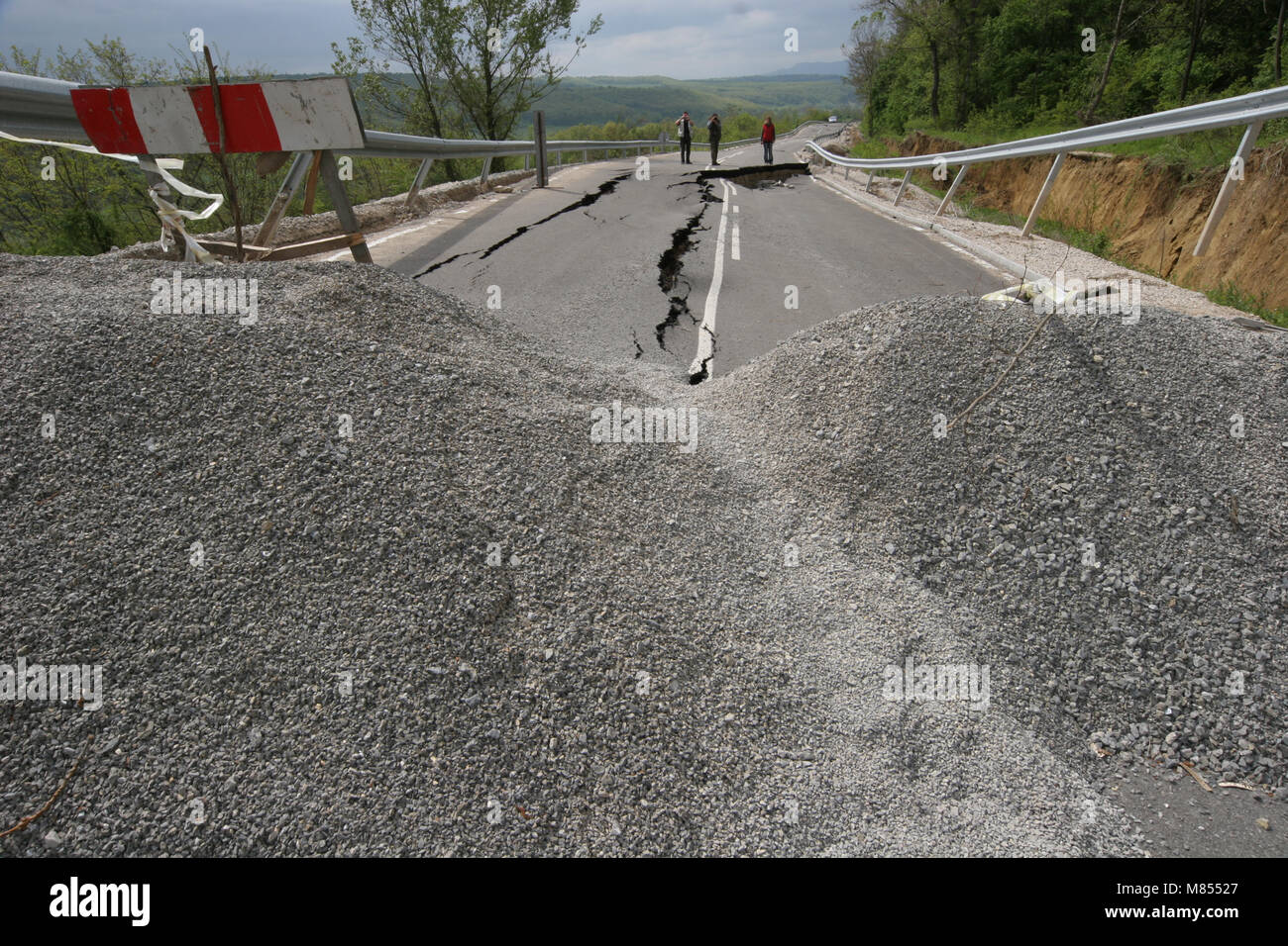 Road collapses with huge cracks. International road collapsed down after bad construction