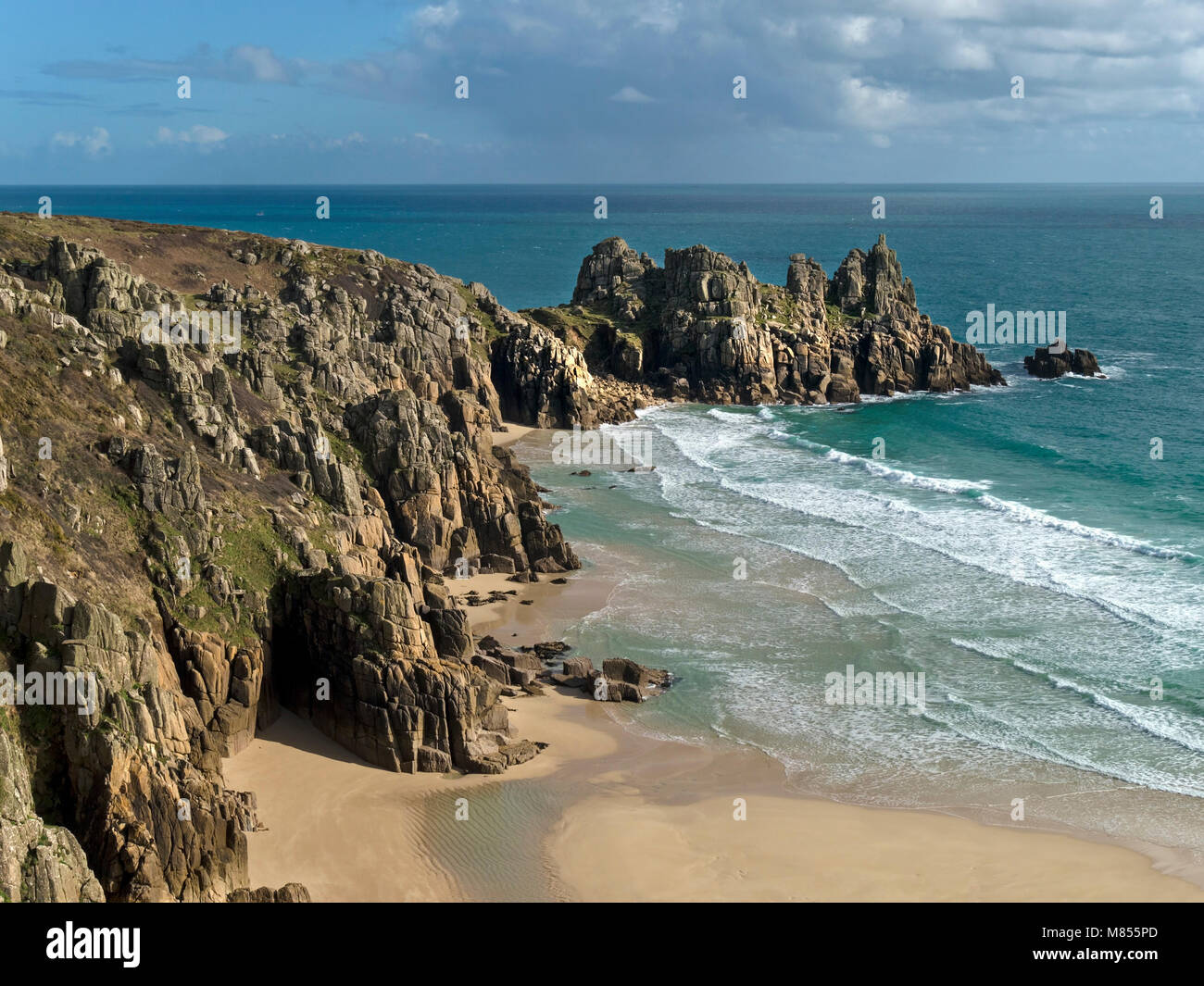 Pedn Vounder beach and Logan Rock headland as seen from South Cornwall Coastal path near Porthcurno, Cornwall, England, UK Stock Photo