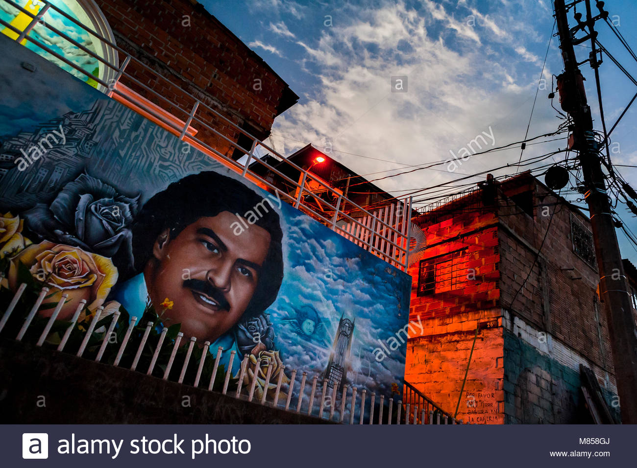 A large mural artwork depicting the lord Pablo Escobar is seen painted on