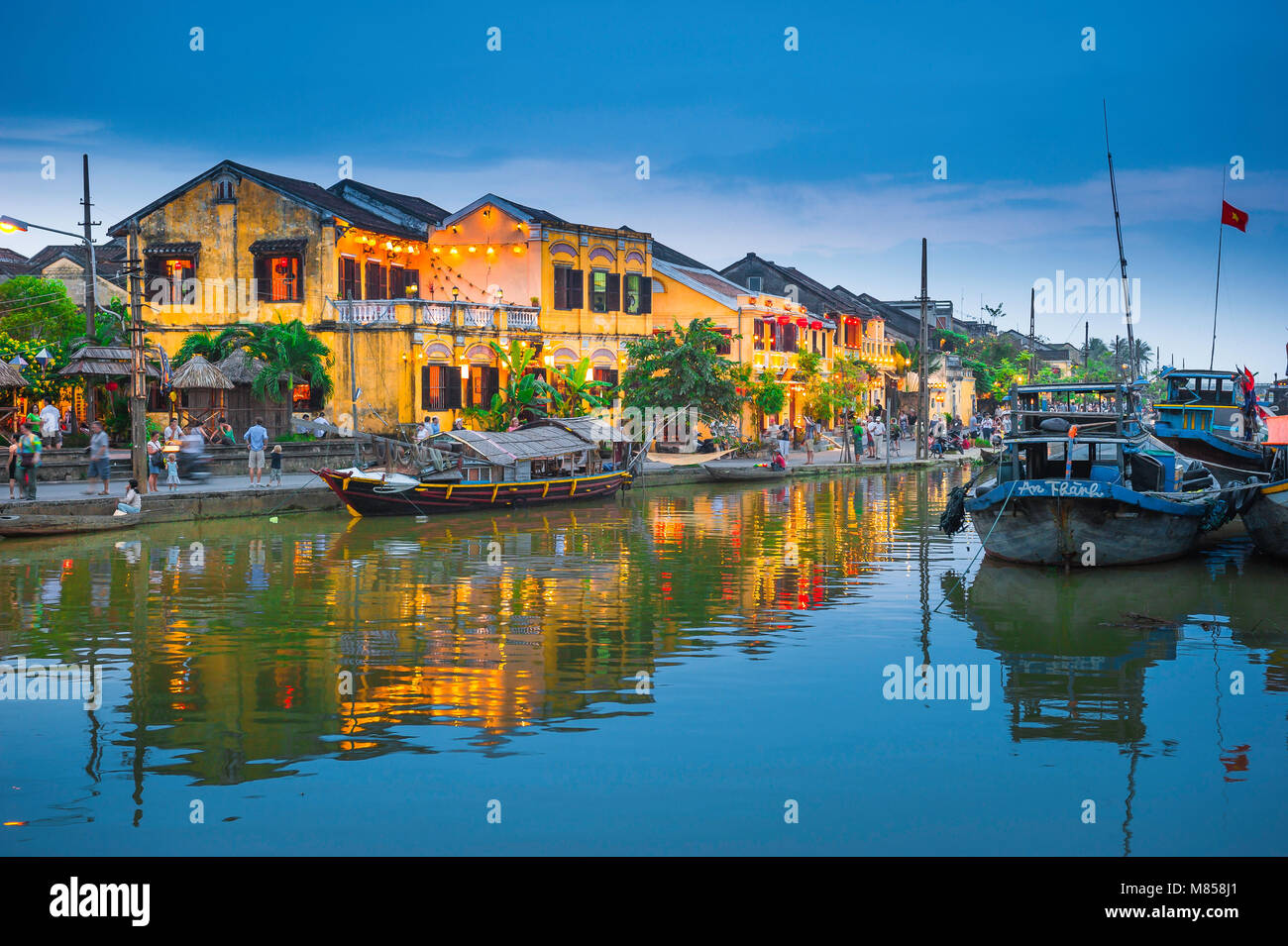 Vietnam travel, scenic view at dusk of the Thu Bon river and Old Town tourist quarter in Hoi An, Central Vietnam, Southeast Asia Stock Photo