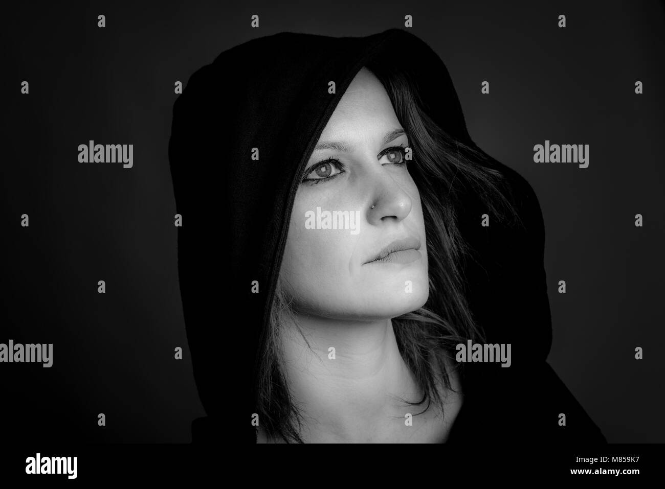 portrait of hooded woman - black and white image Stock Photo - Alamy