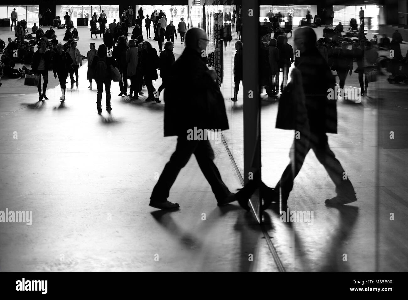 Shadows of people in The Tate's Turbine hall Stock Photo