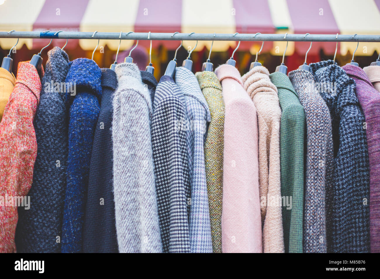 Winter coats hanged on a clothes rack Stock Photo Alamy
