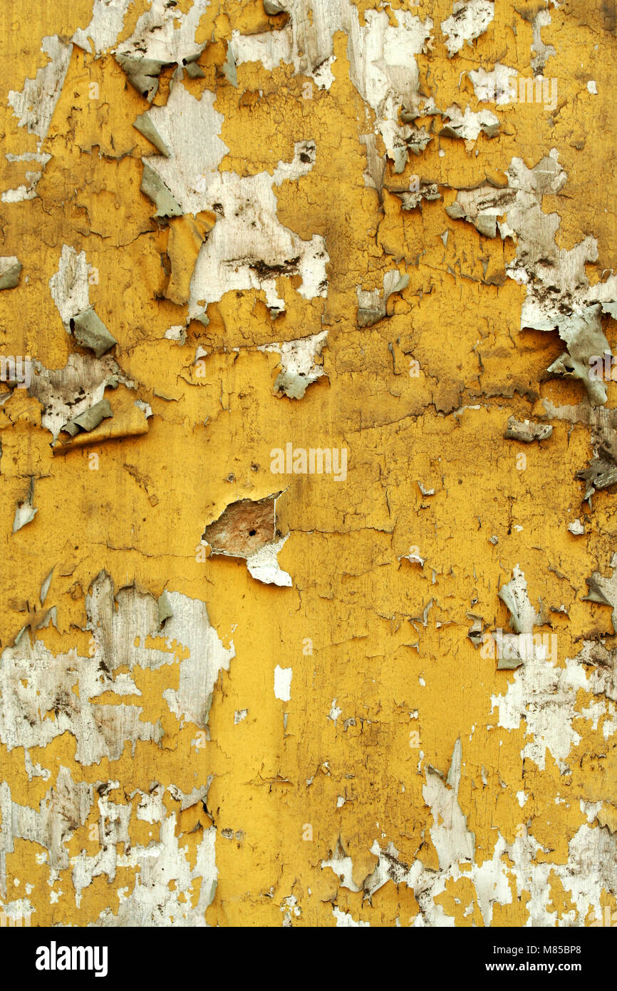 A Old wall with cracked peeling paint Stock Photo
