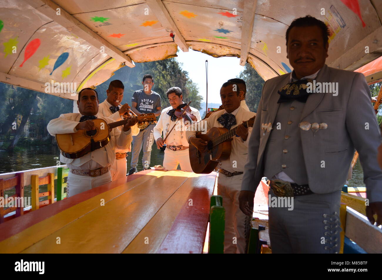 A mariachi band on a boat in Xochimilco, Mexico City Stock Photo