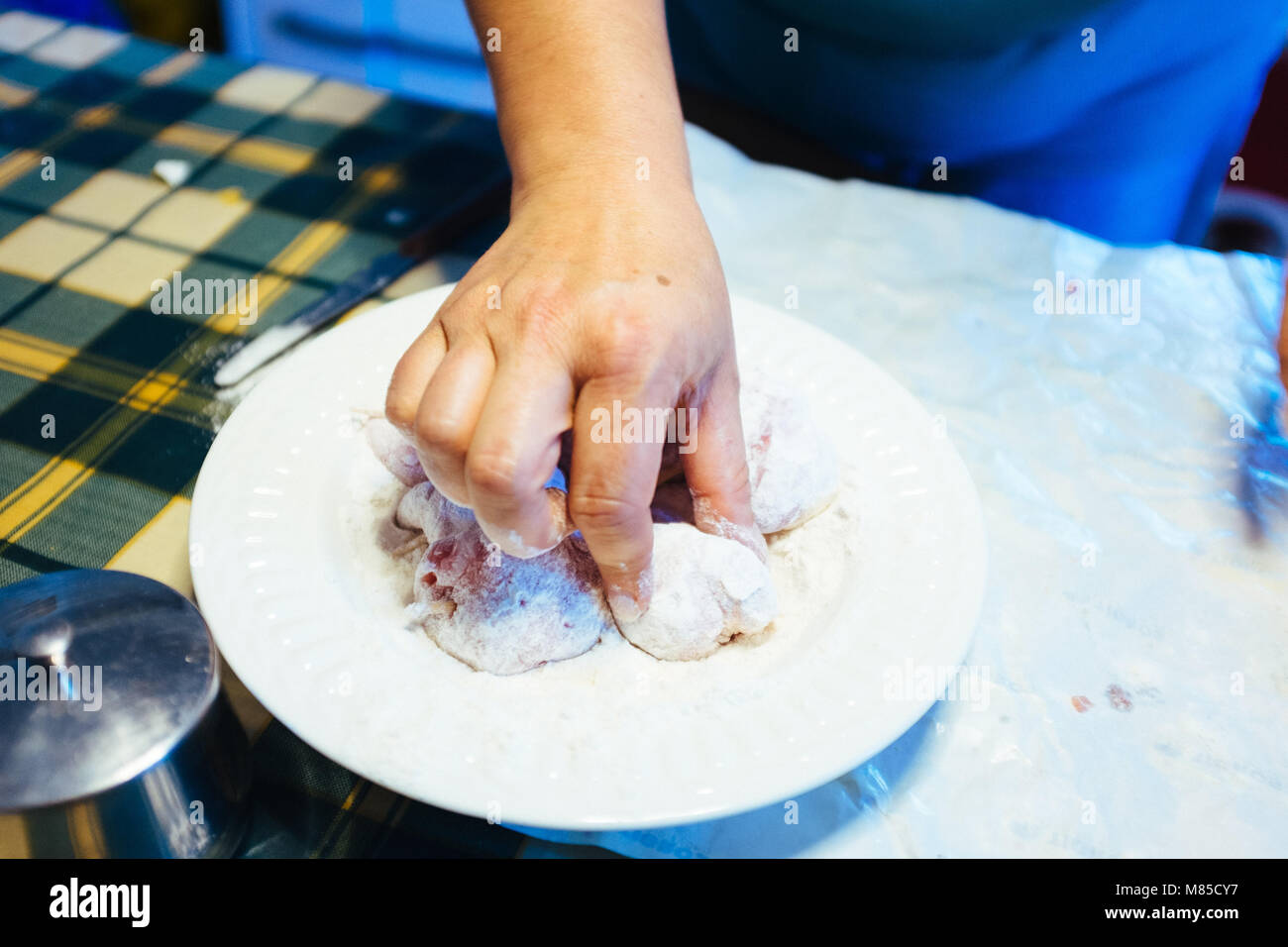 Meat Using Flour hands prepare pieces of meat, put into flour to be cooked,at home Stock ...