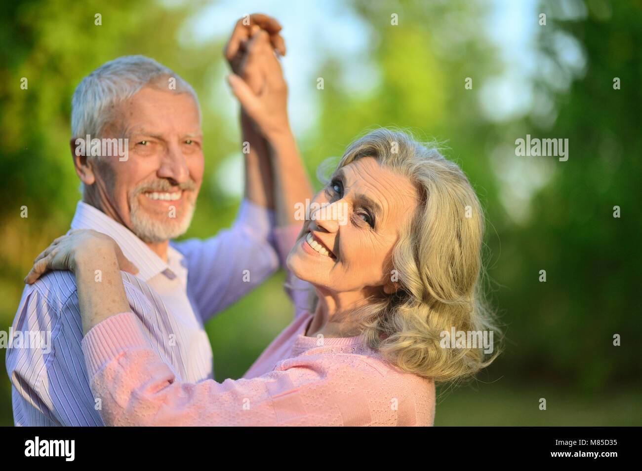 portrait of beautiful caucasian senior couple in the park danci Stock ...