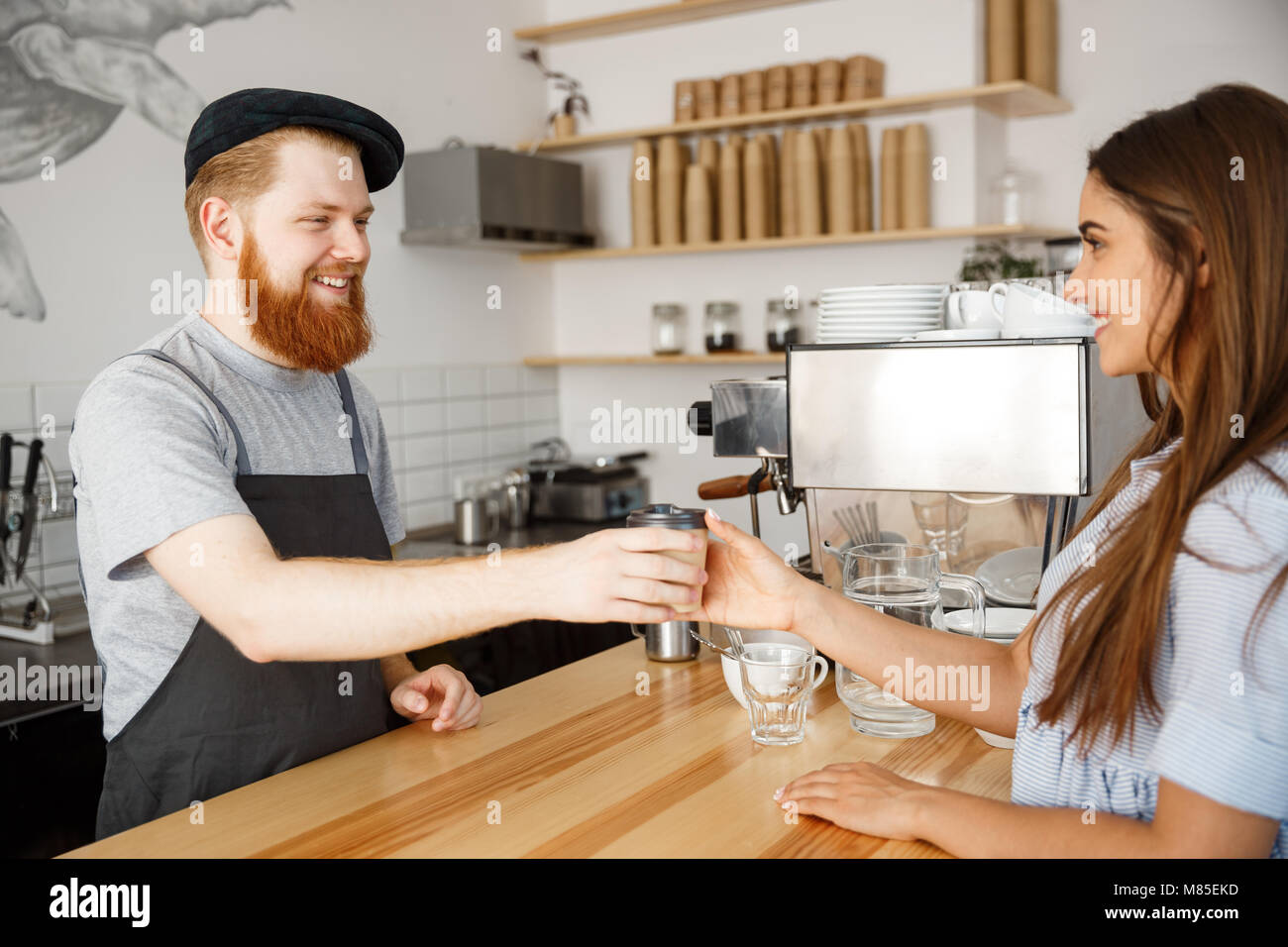 Coffee Business Concept young beared handsome barista talking and