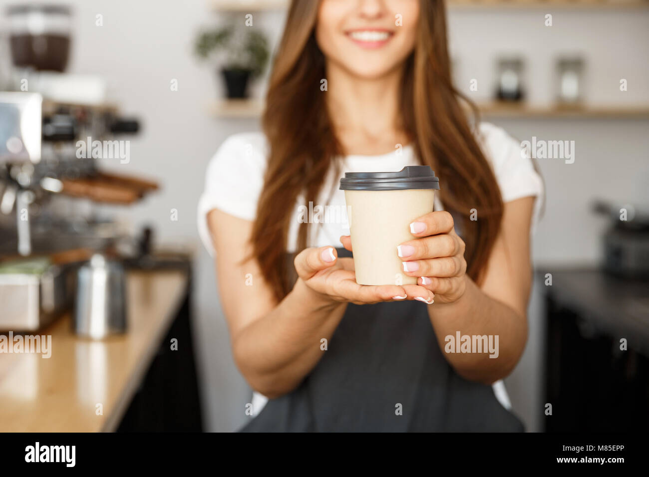 Coffee Business Concept Beautiful Caucasian lady smiling at camera