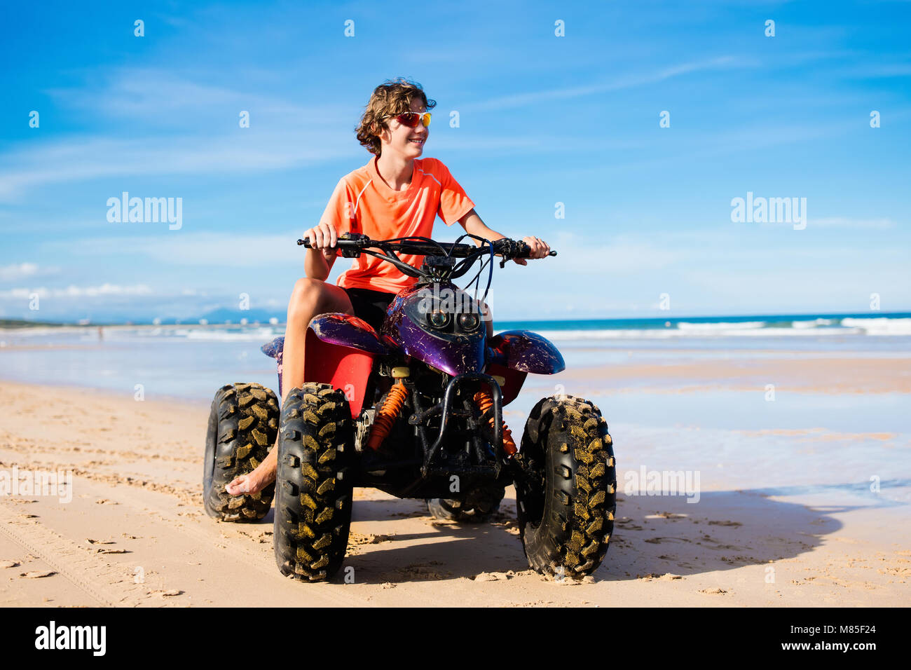 Teen riding quad atv four hires stock photography and images Alamy