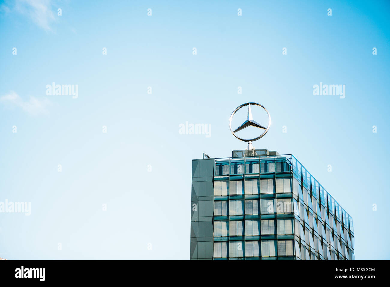 The symbol of Mercedes Benz on the roof of the central office building of the international engineering corporation Mercedes Benz. Stock Photo