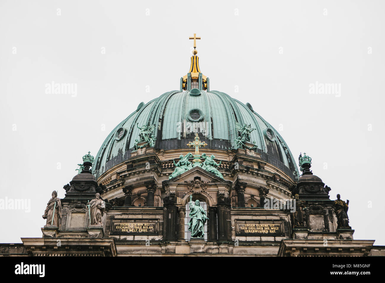 Beautiful old building in the style of neoclassicism and baroque with cross and sculptures Stock Photo